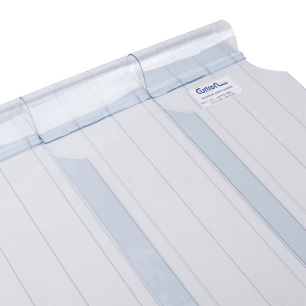 A clear plastic sheet with blue lines on it.