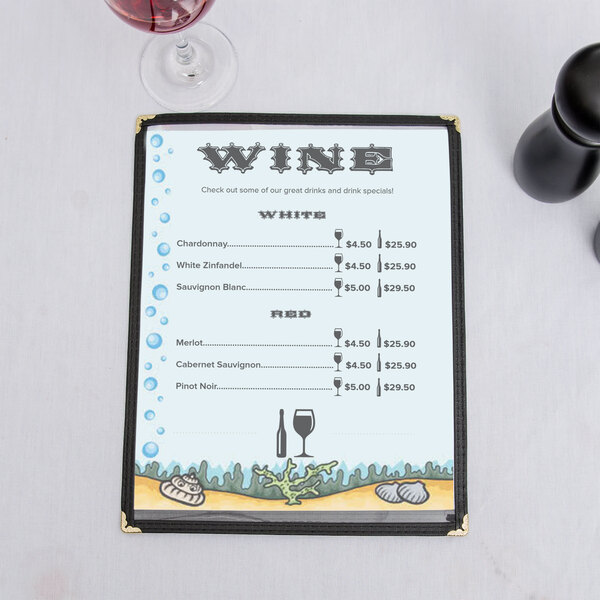 An 8 1/2" x 11" seafood menu with a wine glass on a white surface.