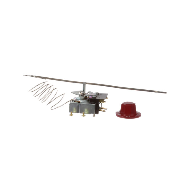 A close-up of a small metal mechanical object with a wire attached.
