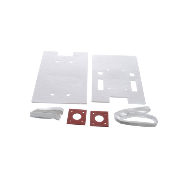 A white plastic kit with two pieces of rubber and white paper with holes.