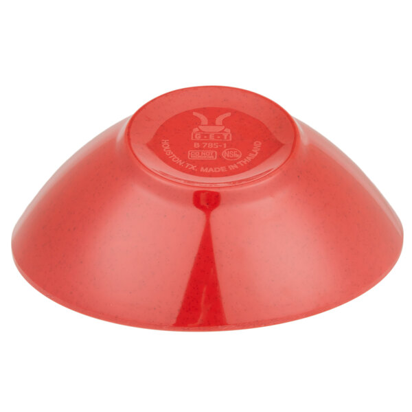 A red bowl with a slanted design and a white logo on it.