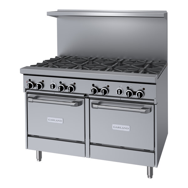 A large stainless steel Garland commercial gas range with 8 burners.