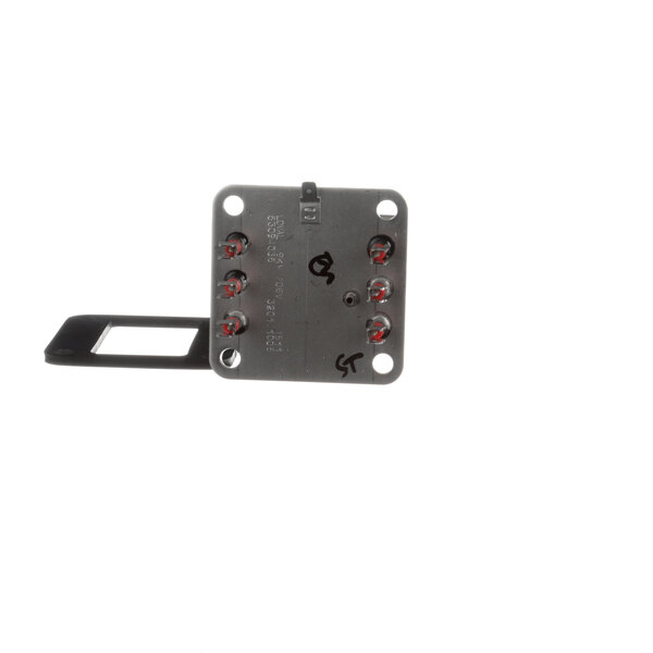A metal square with red buttons.