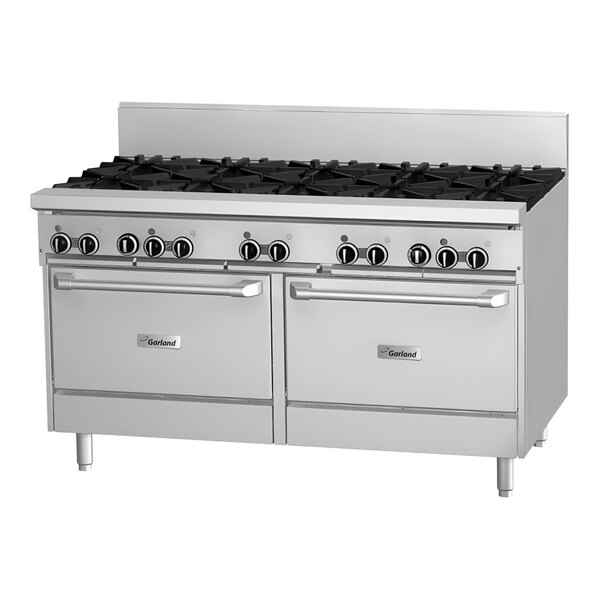 A large stainless steel Garland commercial gas range with 4 burners, a griddle, and 2 ovens.