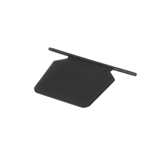 A black plastic rectangular guard with a small hole in it.