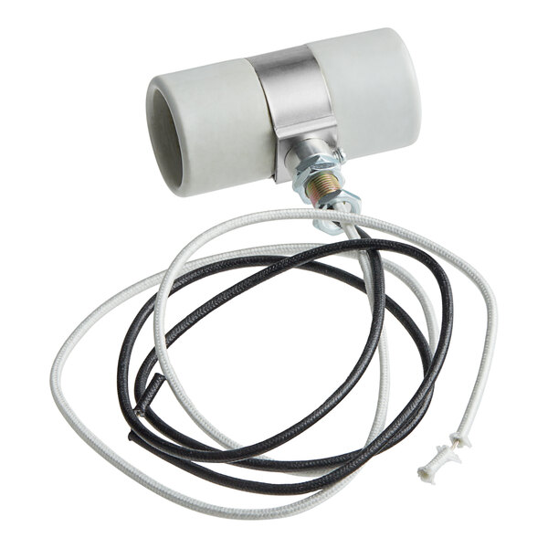 A white tube with black and white wires attached to it.