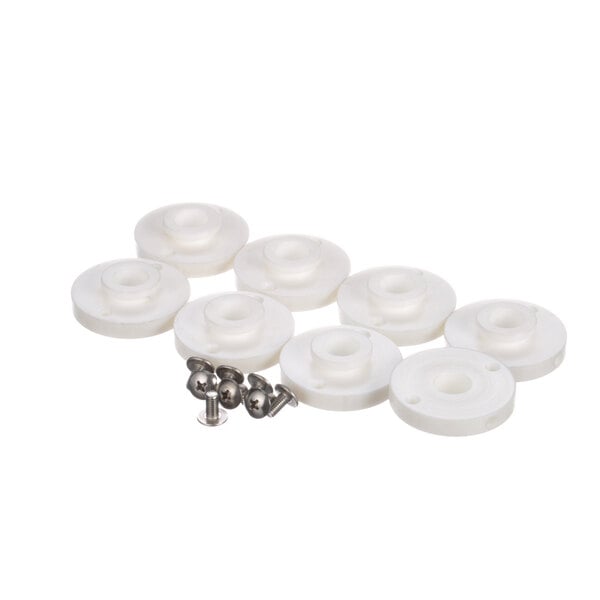 A group of white plastic objects with screws.