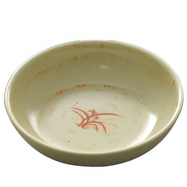 A white bowl with a red design of orchids.