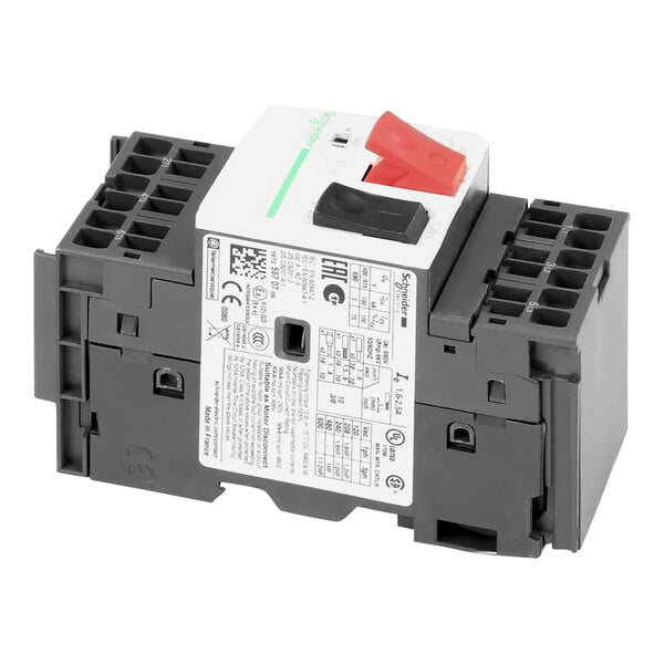 A close-up of a grey electrical device with a white label and black and white switches.