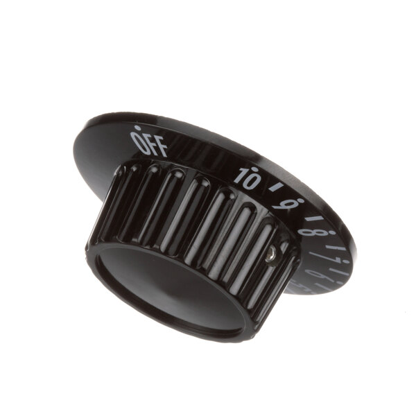 A close-up of a black Groen knob with white numbers.