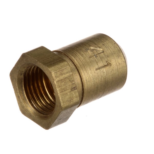 A close-up of a brass threaded nut with a hole.