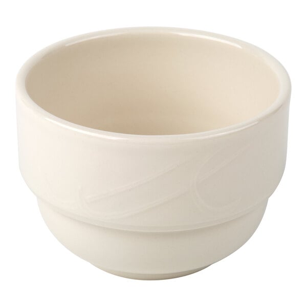 A plain, round, ivory-colored ceramic cup with a smooth finish and slightly thick rim.