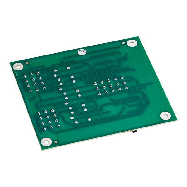 A green circuit board with several silver and black components.