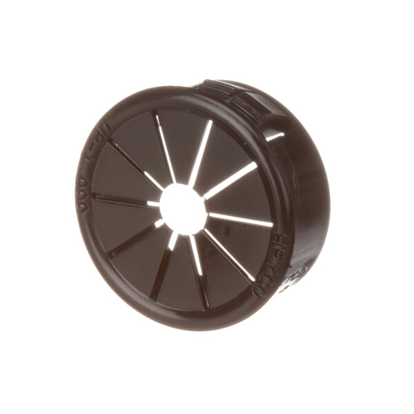 A black circular plastic bushing with a hole in the center.