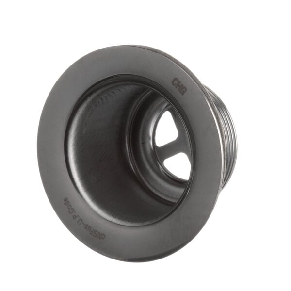 A close-up of a black metal circular object with a wheel shape.