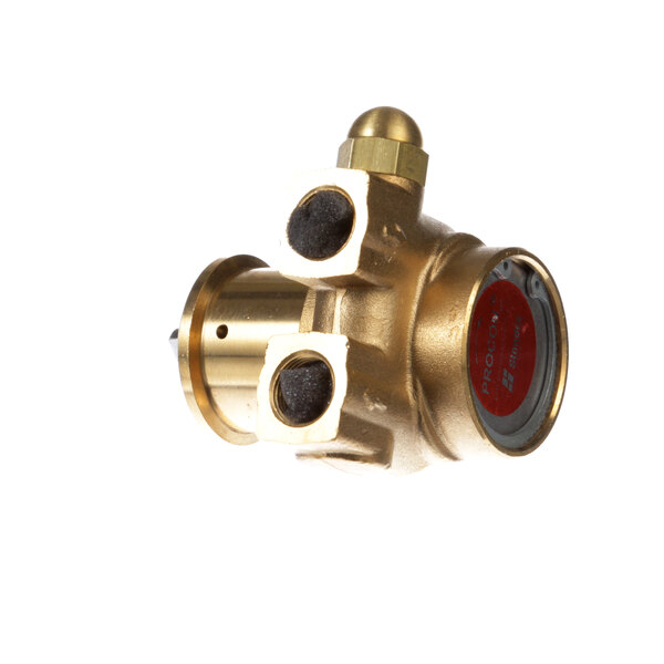 A close-up of a brass Perlick fluid pump with a round cap and a red button.