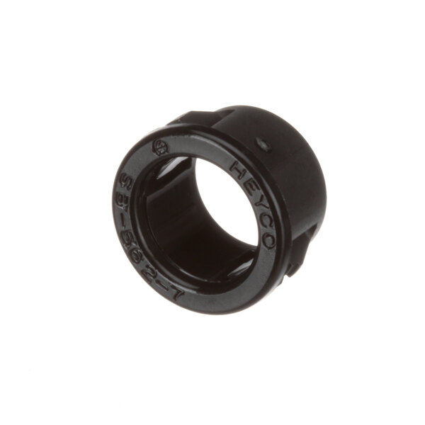 A black plastic sensor bushing with writing on it.