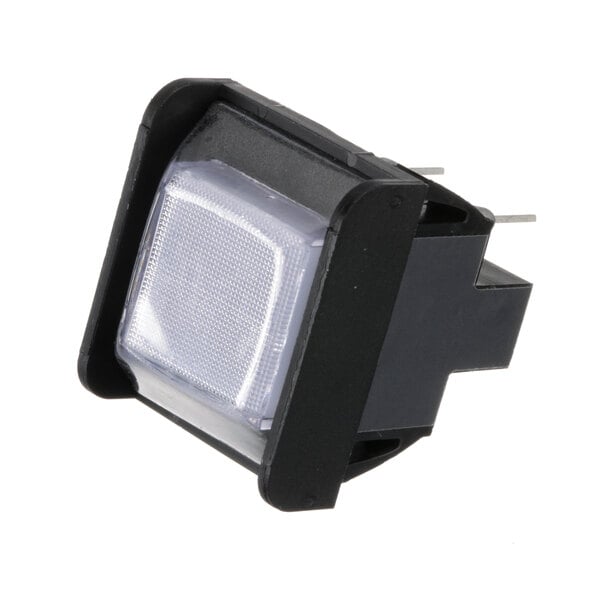 A black square light switch with a white button.