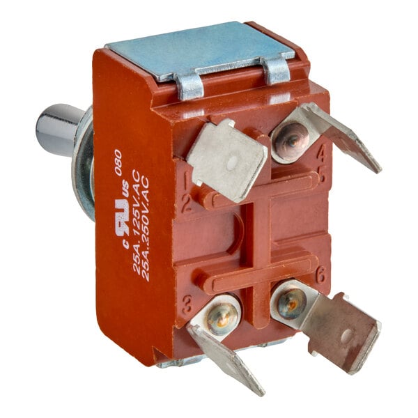 A close-up view of a red electrical power switch with three metal terminals and a metal mounting bracket.