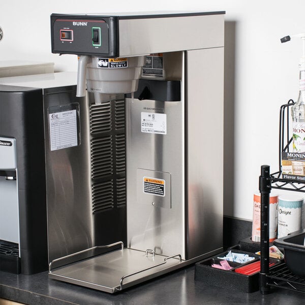 A Bunn 3 gallon iced tea brewer on a counter.