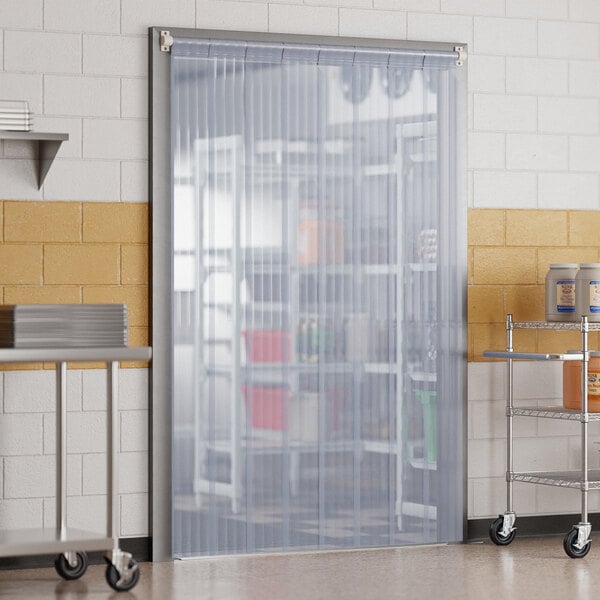 A white sliding strip door on a rolling cart.