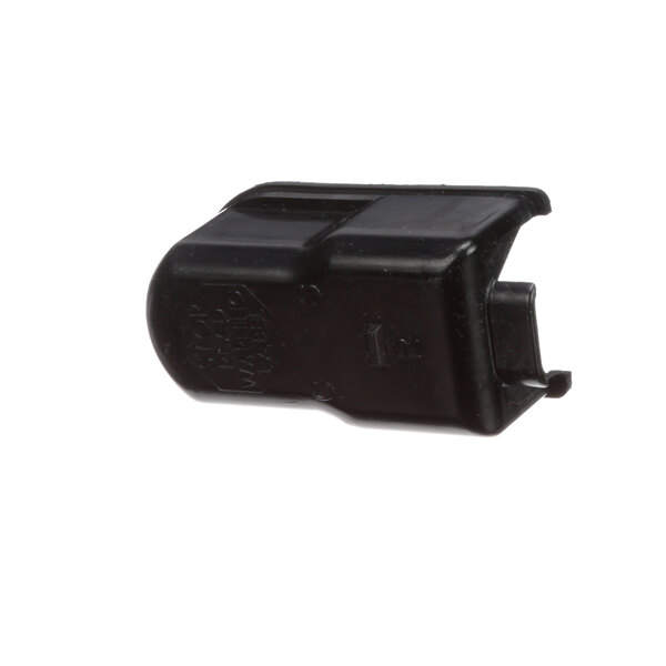 A black plastic True Refrigeration component cover with text on it.