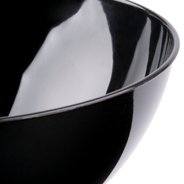 A close-up of a black Fineline plastic bowl.