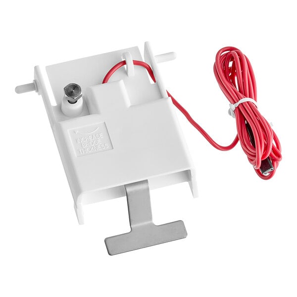 A white Manitowoc Ice thick control device with red wire attached.