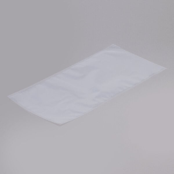 A white rectangular ARY VacMaster vacuum packaging bag on a white surface.
