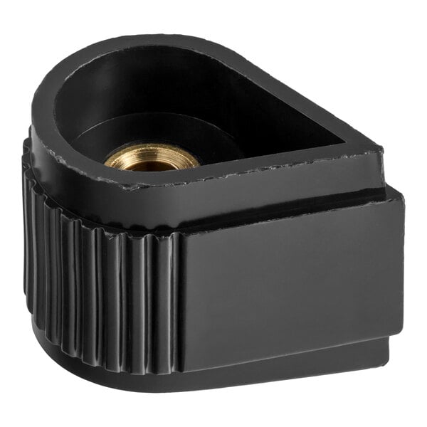 A black, teardrop-shaped plastic knob with a ribbed grip and a central brass insert, viewed from an angle.