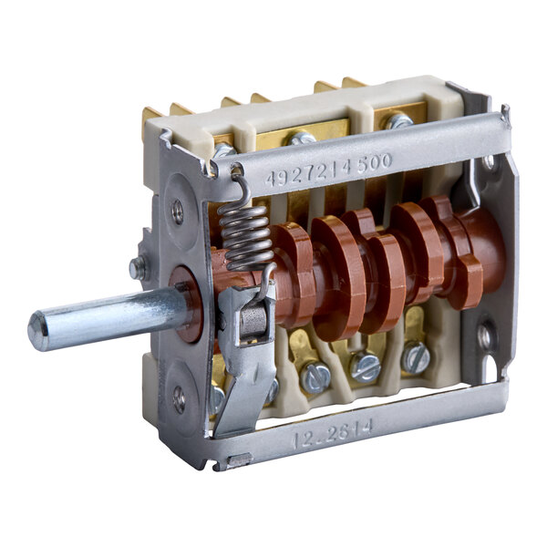 A rotary switch with multiple electrical contacts, a metal shaft, and a spring mechanism, mounted on a rectangular frame.