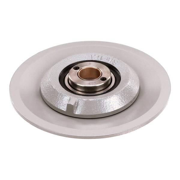 A white metal round disc with a hole and metal ring on it.