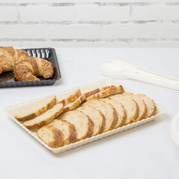 A tray of sliced bread on a table.