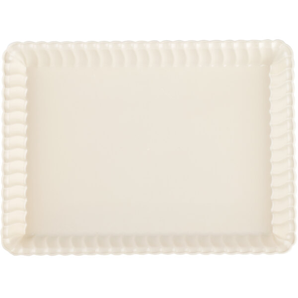 A white rectangular tray with scalloped edges.