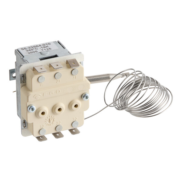 A close-up of a BKI Thermostat with a wire.