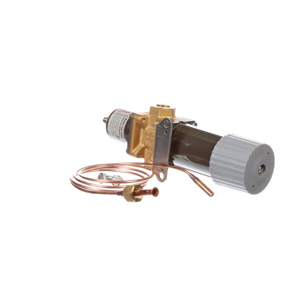 A close-up of a Follett water regulating valve with copper tubing.