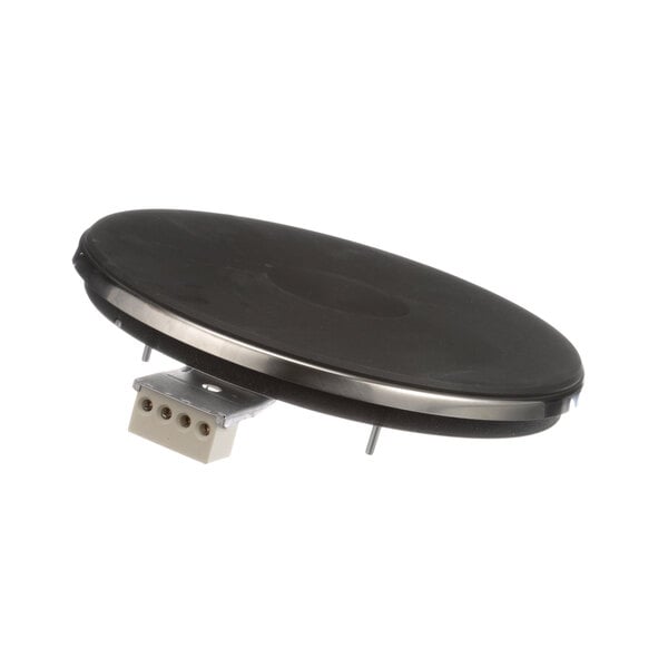 A black circular French plate with a metal frame.