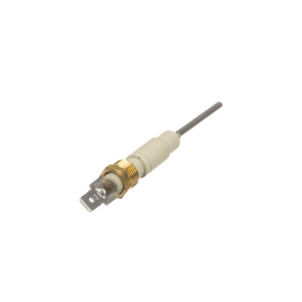 A close-up of a white and gold electrical device with a small hole.