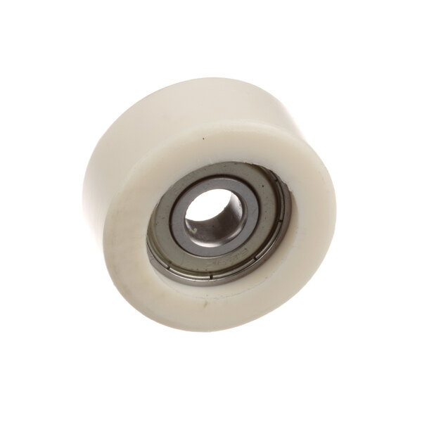 A white plastic Berkel roller bearing wheel with a hole in the center.