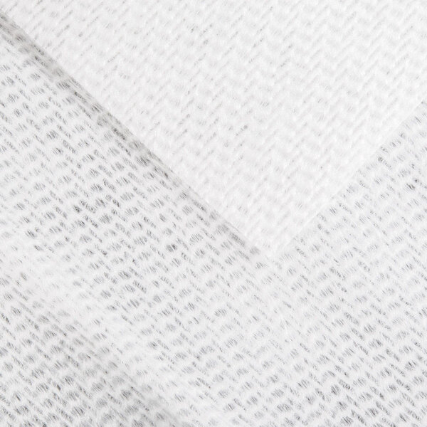A close up of a white Chicopee DuraWipe fabric with a pattern.
