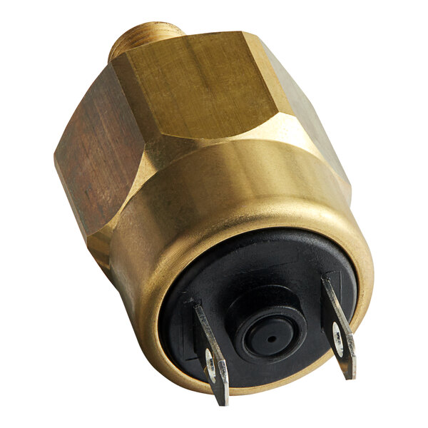 A brass pressure switch with a black plug.