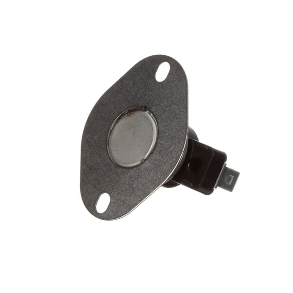 A close-up of a black metal Groen thermostat button with a hole in the center.