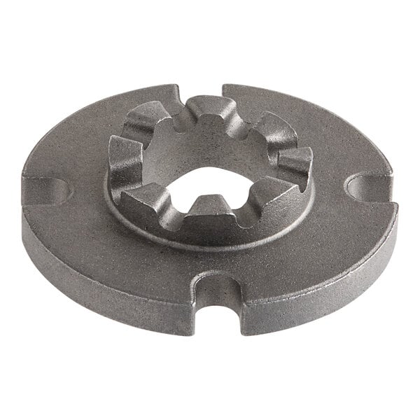 A grey metal Hobart disc with a hole in the center.