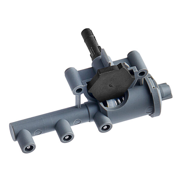 A grey plastic device with a black handle.