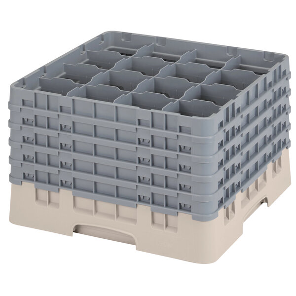 A beige plastic Cambro glass rack with 16 compartments and 5 extenders.