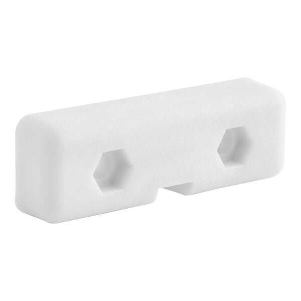 A white plastic slide with holes.