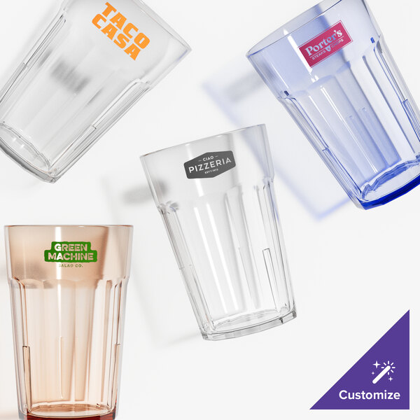 A group of clear Cambro plastic tumblers with a red logo on one.
