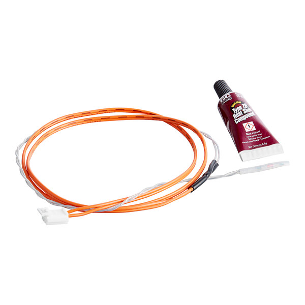 A tube of Hoshizaki Ts005 thermistor sealant with a black cap next to an orange cable.