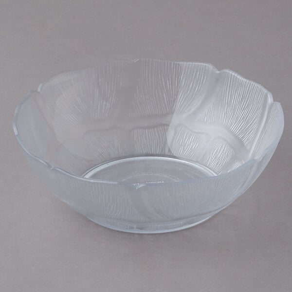 A clear plastic bowl with a curved edge.