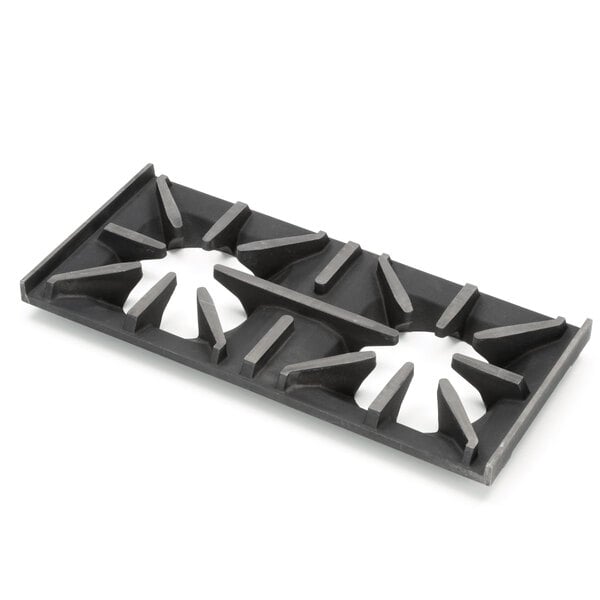 A black metal Garland open top grate with holes.